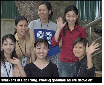 Workers at Bat Trang, waving goodbye